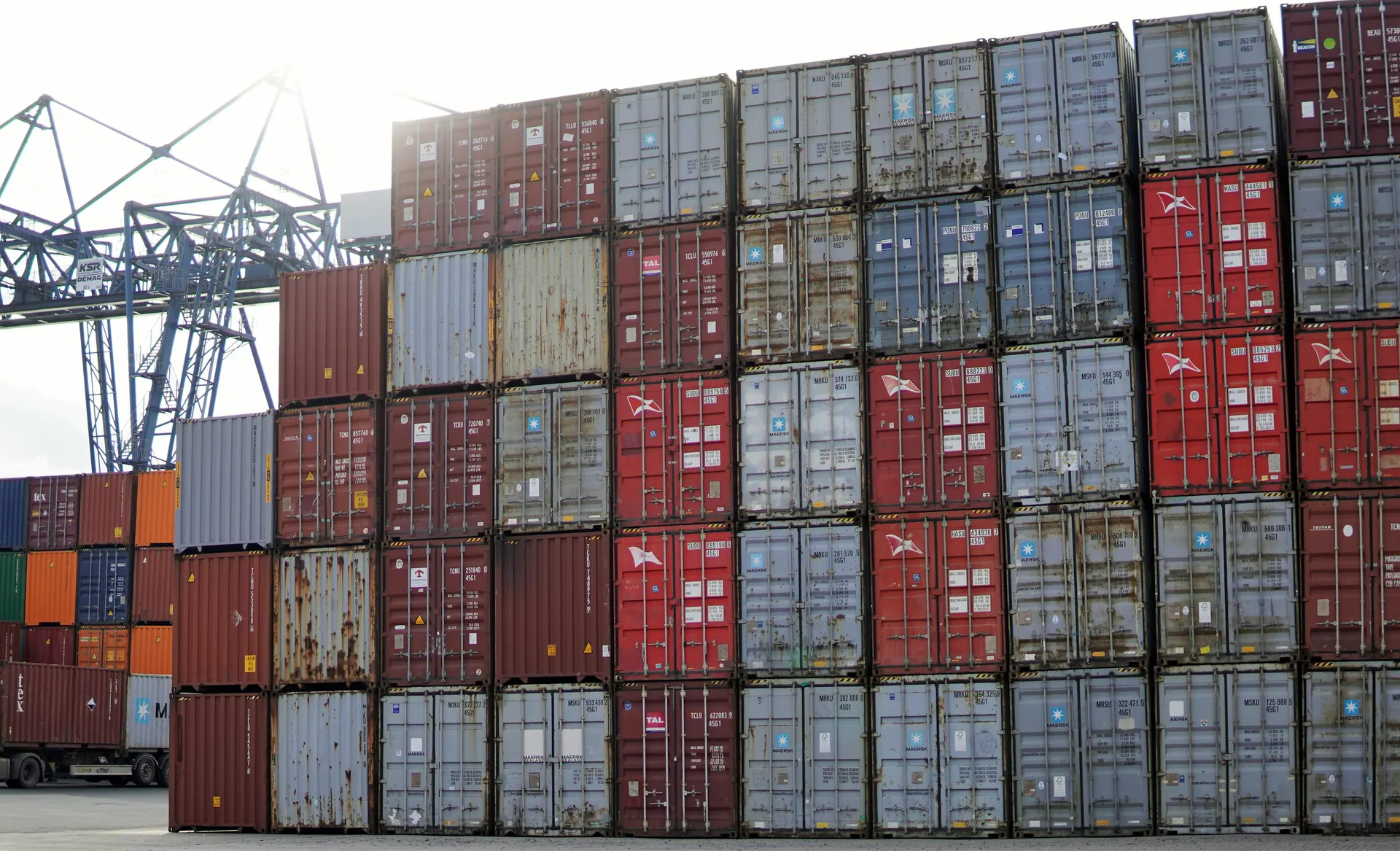 Shipping containers stacked in a port terminal yard